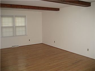 Living Room with Exposed Beams & Hardwood Flr