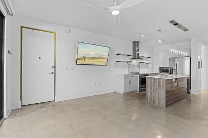 A large living room with a 65" HDTV.