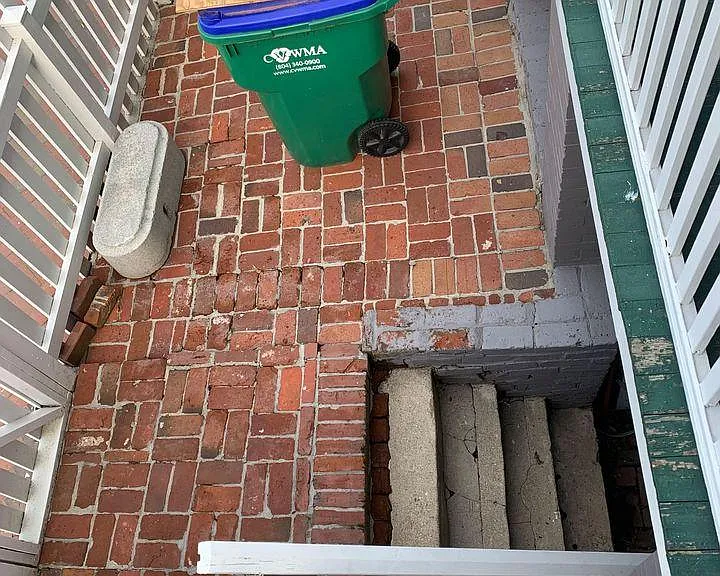Old photo (porch redone) but a view of the downstairs front-facing entrance from top porch