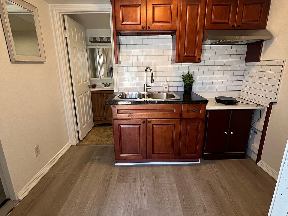New backsplash, kitchen faucet, new induction cooktop fresh paint throughout, new flooring
