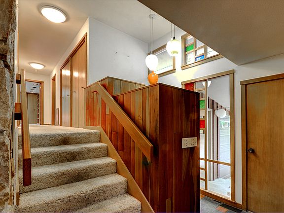 You'll love the 2 story foyer featuring slate entry with period lighting and large coat closets.
