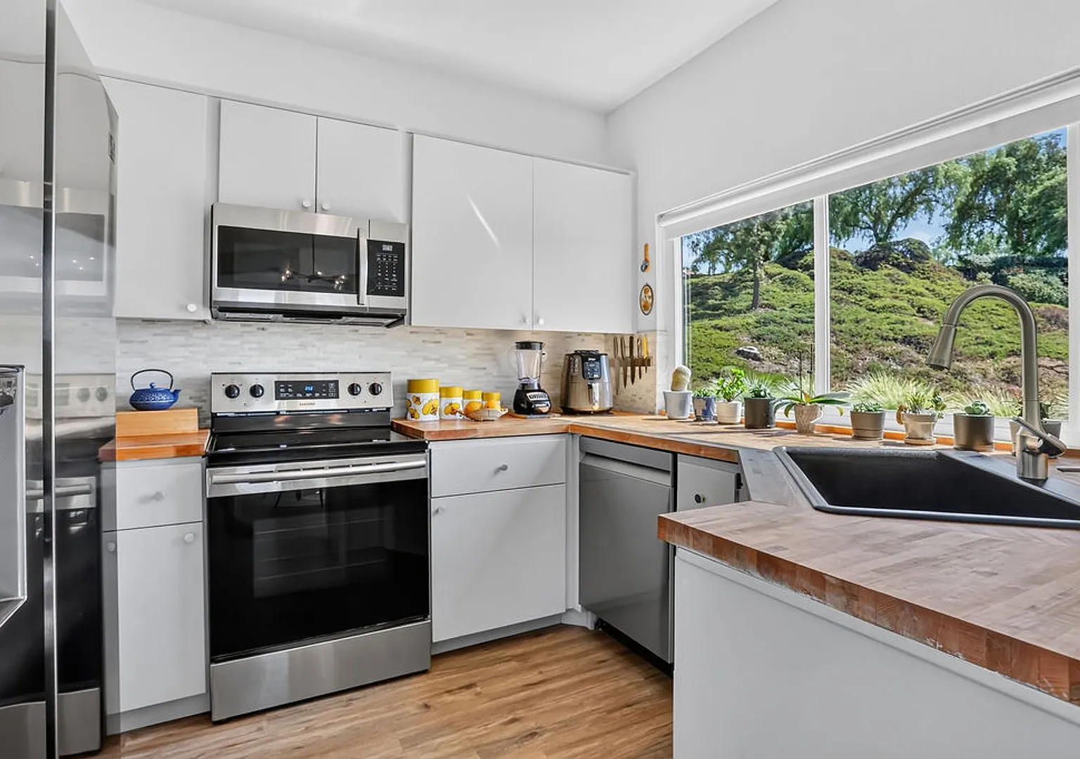 Furnished Upgraded 2-bed, 2-bath Private End-Unit with Immersive Nature Views — Photo 1