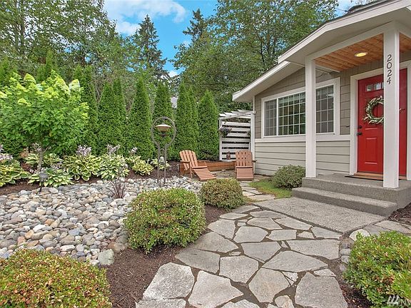 Updated cement board siding and cement board shakes make for low maintenance on your siding for years to come.  T&G soffit at front door.  Cozy sitting area to read and watch the humming birds.   