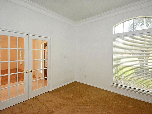 Enjoy your own personal study with French doors, crown molding and new plush carpeting! Get a perfec