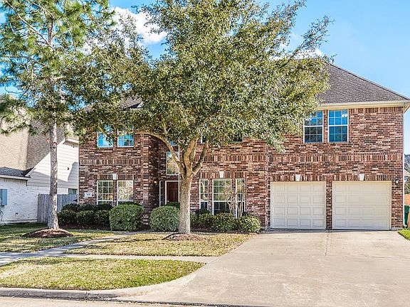 RELAX OUTSIDE IN THIS SPACIOUS BACKYARD AND WARM UP NEXT TO THE FIRE PIT WITH PLENTY OF SPACE TO ENTERTAIN FRIENDS