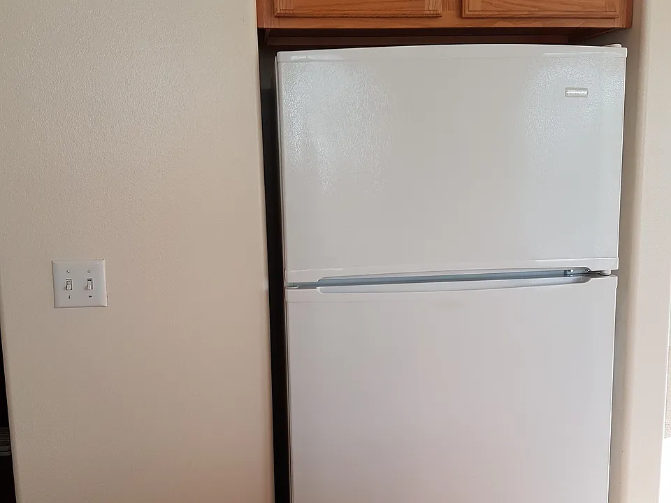 Oversized refrigerator in the kitchen with additional overhe