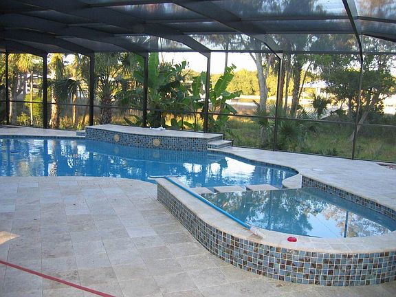 Screened pool with hot tub