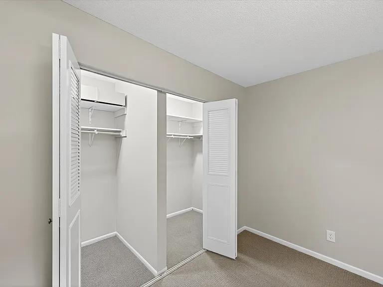 Bedroom: Double walk-in closets
