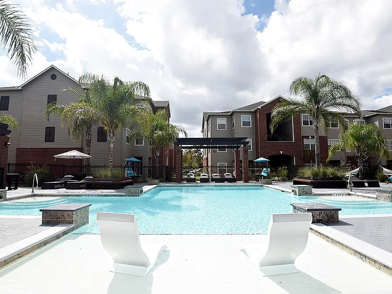 Beautiful pool with ample seating, creating the perfect outdoor retreat, offering a relaxing escape right at home