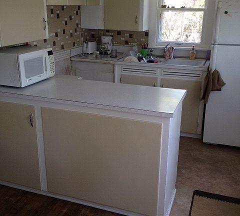Kitchen - the back door is to the right in this picture and leads to the upper deck.