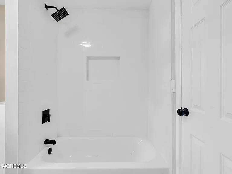 New tub and shower with matte black fixtures