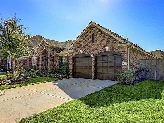 Parking is a snap in the two car garage and double wide driveway.