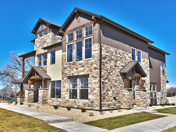 The entrance to this unit is on the left of this photo. This is the only building in the community with just two units. Only one neighbor! Garage is located on the back of the building. Your view to the west is completely unobstructed.