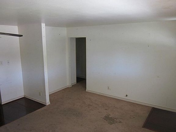 Open concept. Carpet and wood combination