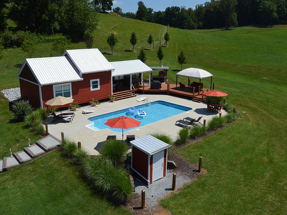 aerial view of house, pool, bar area, wood fired pizza oven. Pool closes around 10/1/22