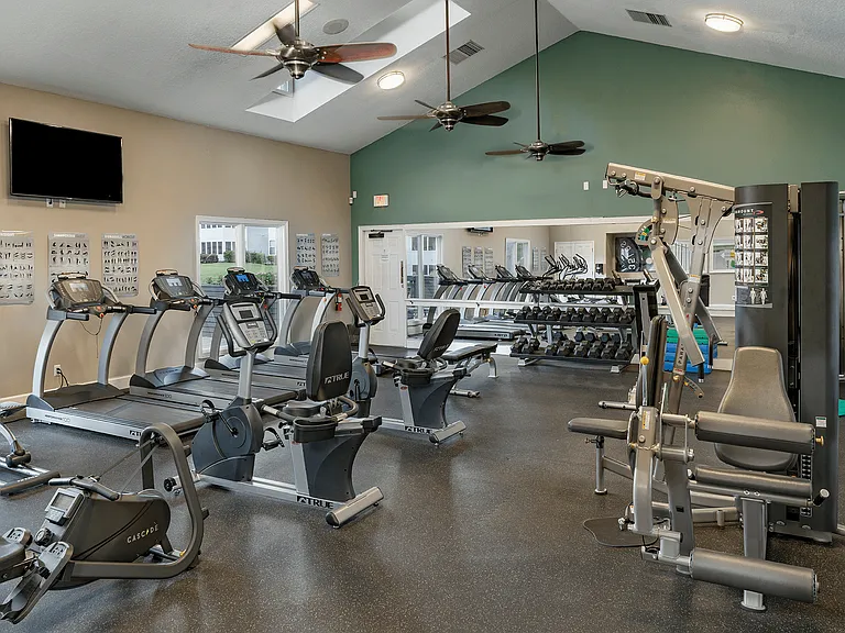 Fitness center features cardio and weight machines