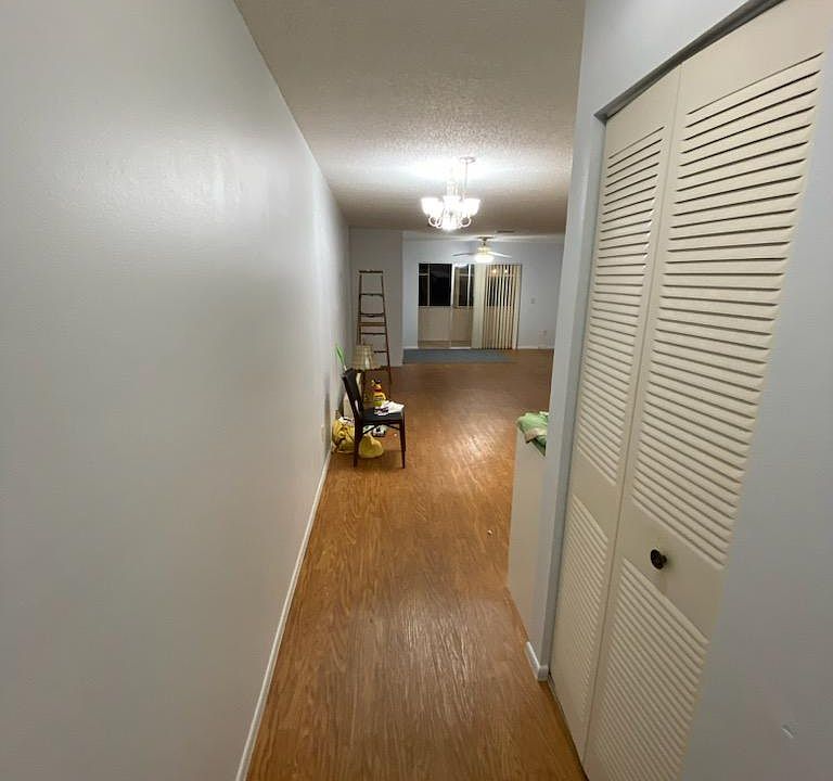 Entrance way, freshly painted with entrance closet