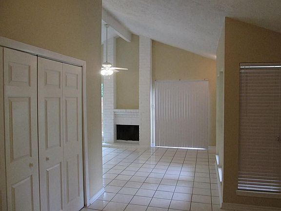 OPEN FLOOR PLAN WITH FIREPLACE AT CENTER.