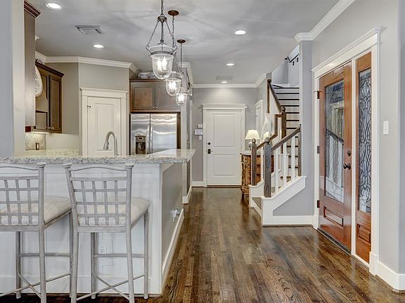 Open-concept layout with the kitchen, dining room, and living room open to one another.