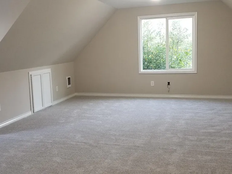 Extra large bonus/bedroom with vaulted ceilings, lots of closet and storage space, and Eastern and Southern exposure and views