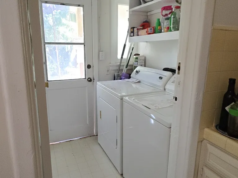 Separate wash room that closes. Washer and dryer included.