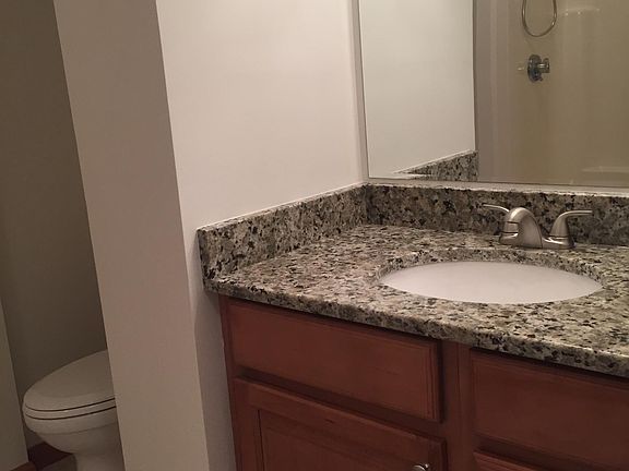 Bathroom - Has tile flooring; bathtub/shower; linen closet; newer toilet, granite counter top, sink, faucet and shower head.