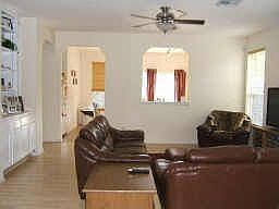 open large living room with built in cabinets