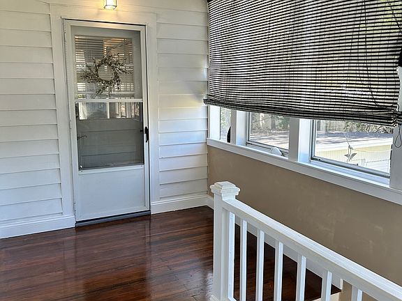 Unit door, enters into mudroom with laundry hook-ups, shelves, and double coat closet.