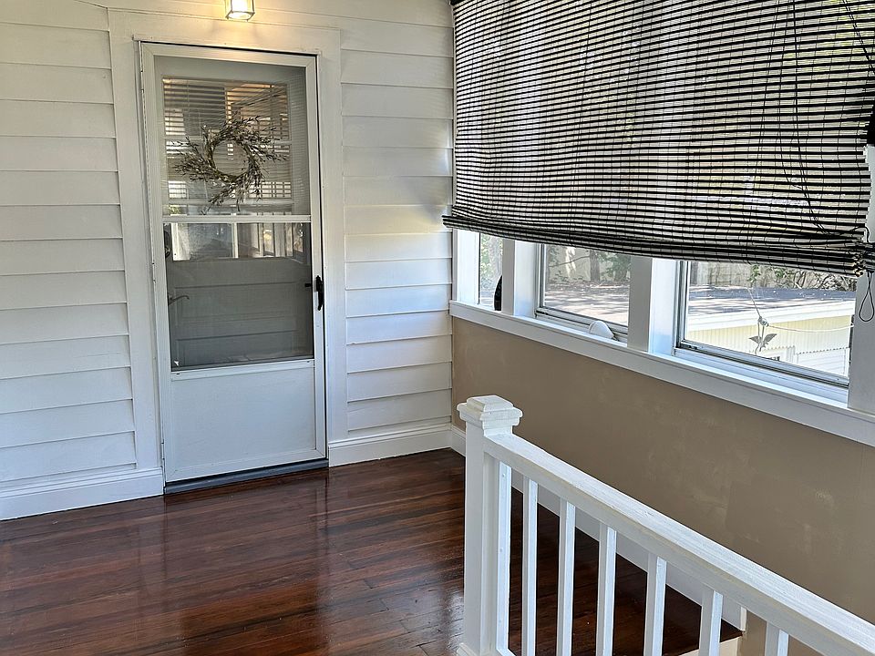 Unit door, enters into mudroom with laundry hook-ups, shelves, and double coat closet.