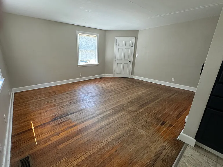 Living Room from kitchen looking at entry door