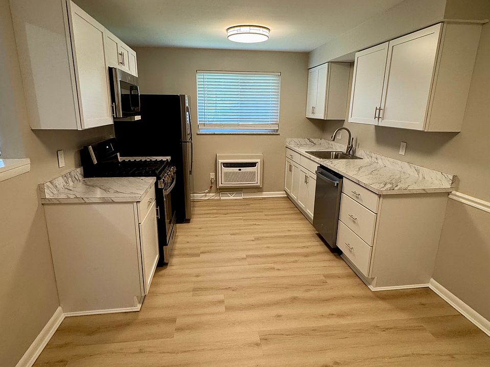 The kitchen was remodeled down to the studs in 2026 with LVP floors, brand new appliances, and all new cabinets and counter tops