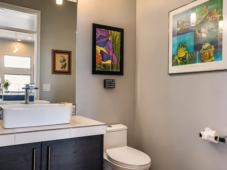 Powder room off of art gallery