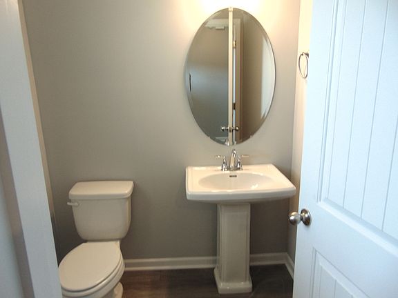 This powder room for all your guests, comes with a updated modern sink, and an elongated toilet for