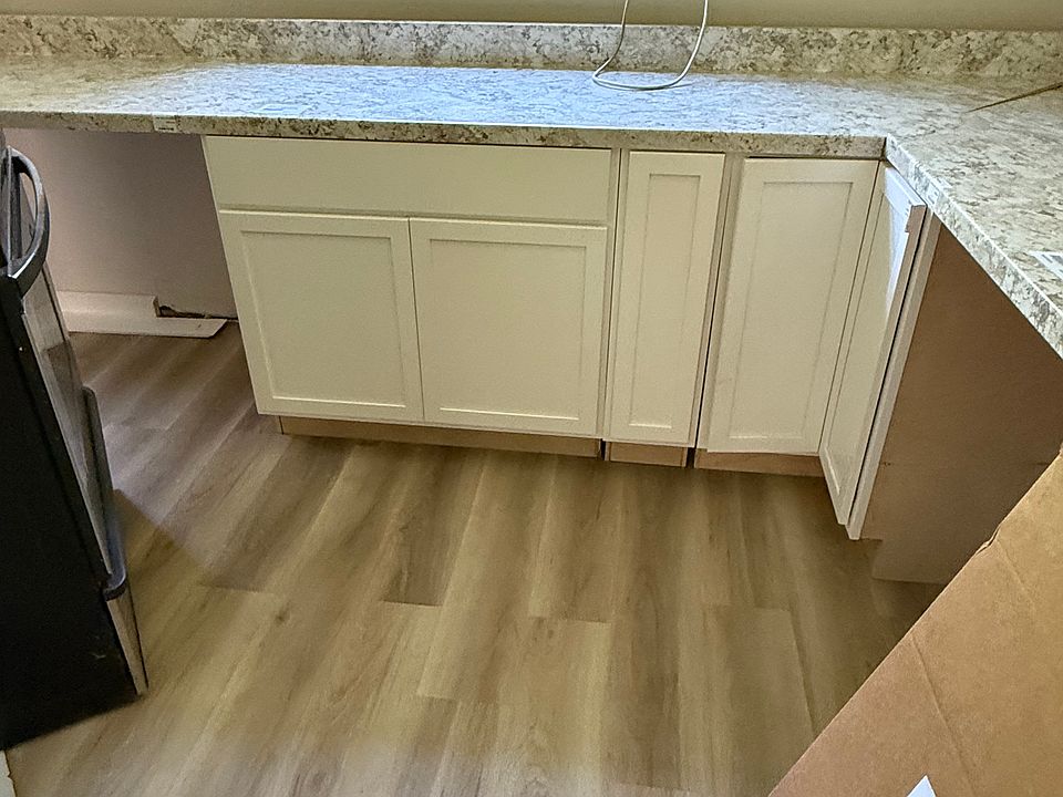 New kitchen cabinets and countertops waiting to be installed.