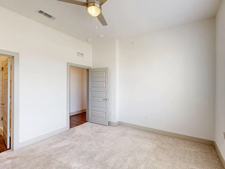 Spacious apartment Bedroom with Carpet Floor.