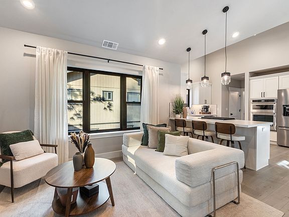 King Size Sofa Bed in Living Room next to Open Setting Bar