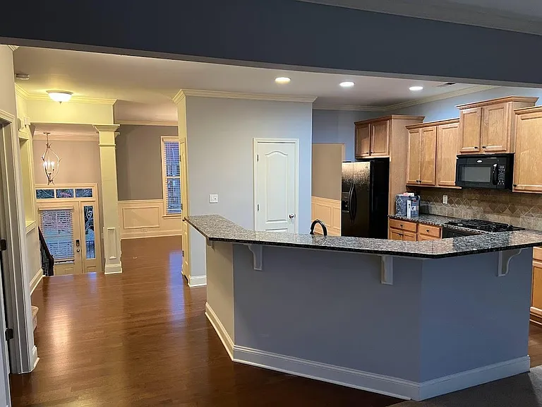 Kitchen with granite countertops, hardwood floor