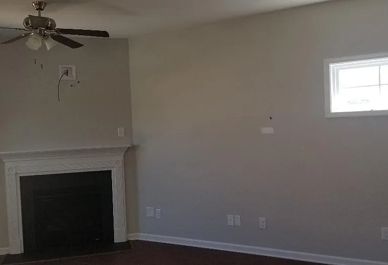 Open floor plan. Family room with fire place & lots of windows.