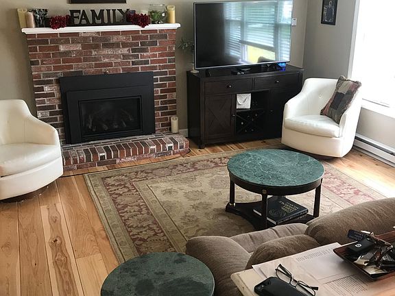 Upstairs living-room with hardwood floors.