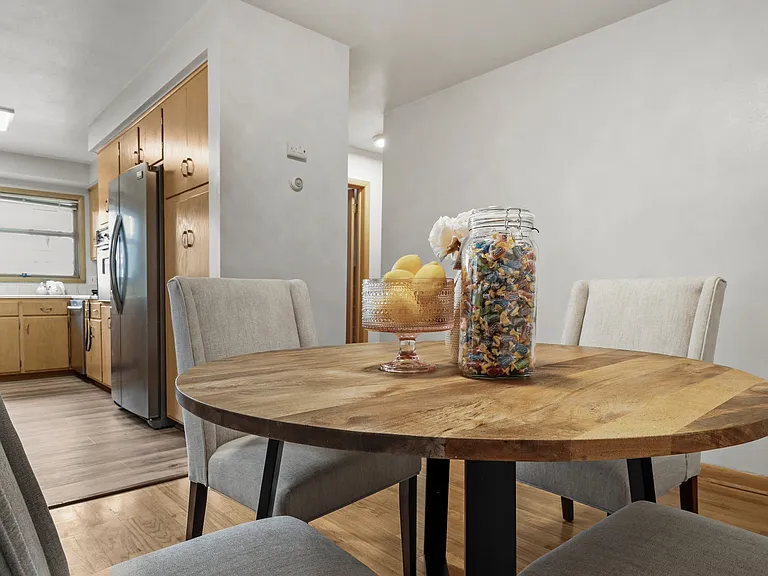 Another shot of the dining room. You can see the transition into the more private rooms. New luxury floors in kitchen.