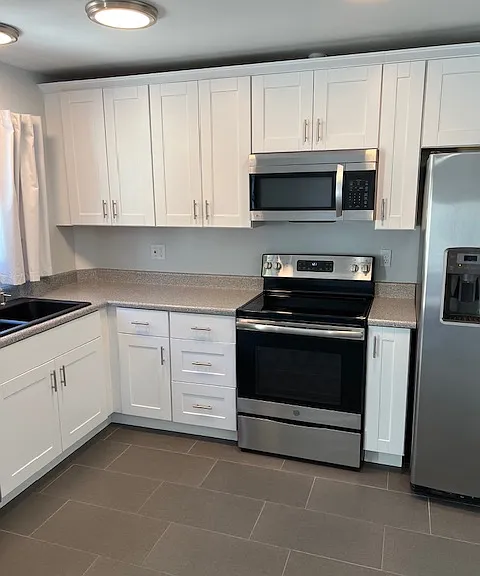 Kitchen, Kitchen Lighting, Granite Sink, Cabinets, Appliances, Tile and Grout Flooring, Newly Painted Ceiling, Walls, Baseboard and Molding.