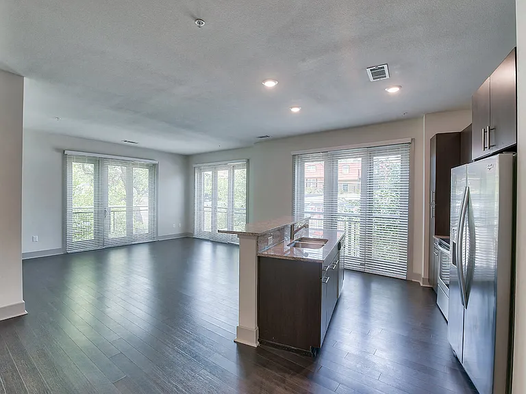 Open living spaces featuring ample windows