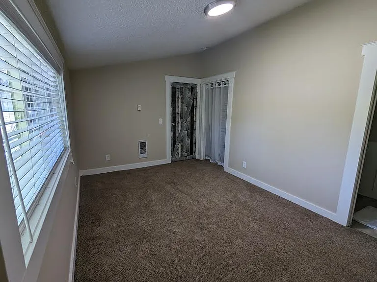 Upstairs bedroom with closet.