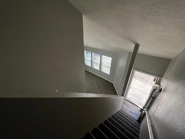 View of living room from top of stairs