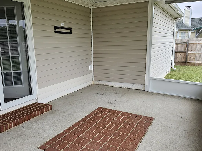 Full view of the "Covered Screened Porch"; new/modern fan; great area for enjoyment and entertaining!