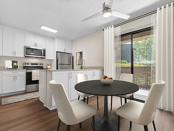 Renovated Package I kitchen and dining room with hard surface flooring