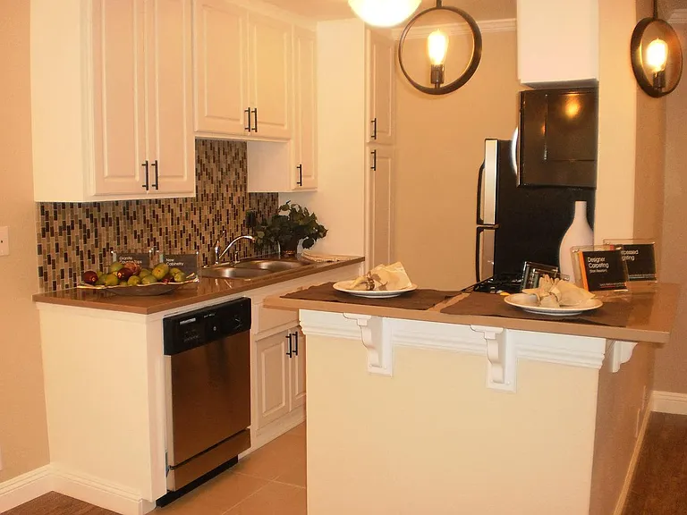 Spacious Kitchen with ceramic tiles, granite counter tops and stainless steel appliances.