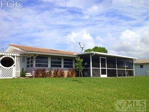 A large expansive yard with sprinkler system also rain gutters all around and a added bonus of a extras storage area that you have to see to believe with storage for all your lawn and gardening things etc. Its just beautiful!