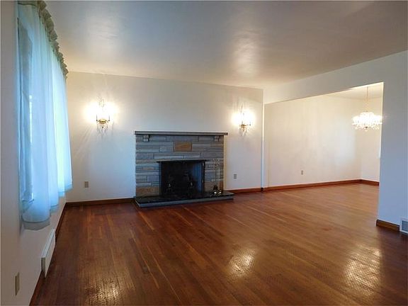 *Spacious Living Room with Cozy Fireplace Featuring Elegant Lighting!* *Light and Bright Rooms!*