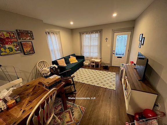 This photo showcases the great room with the combined living and dining rooms.